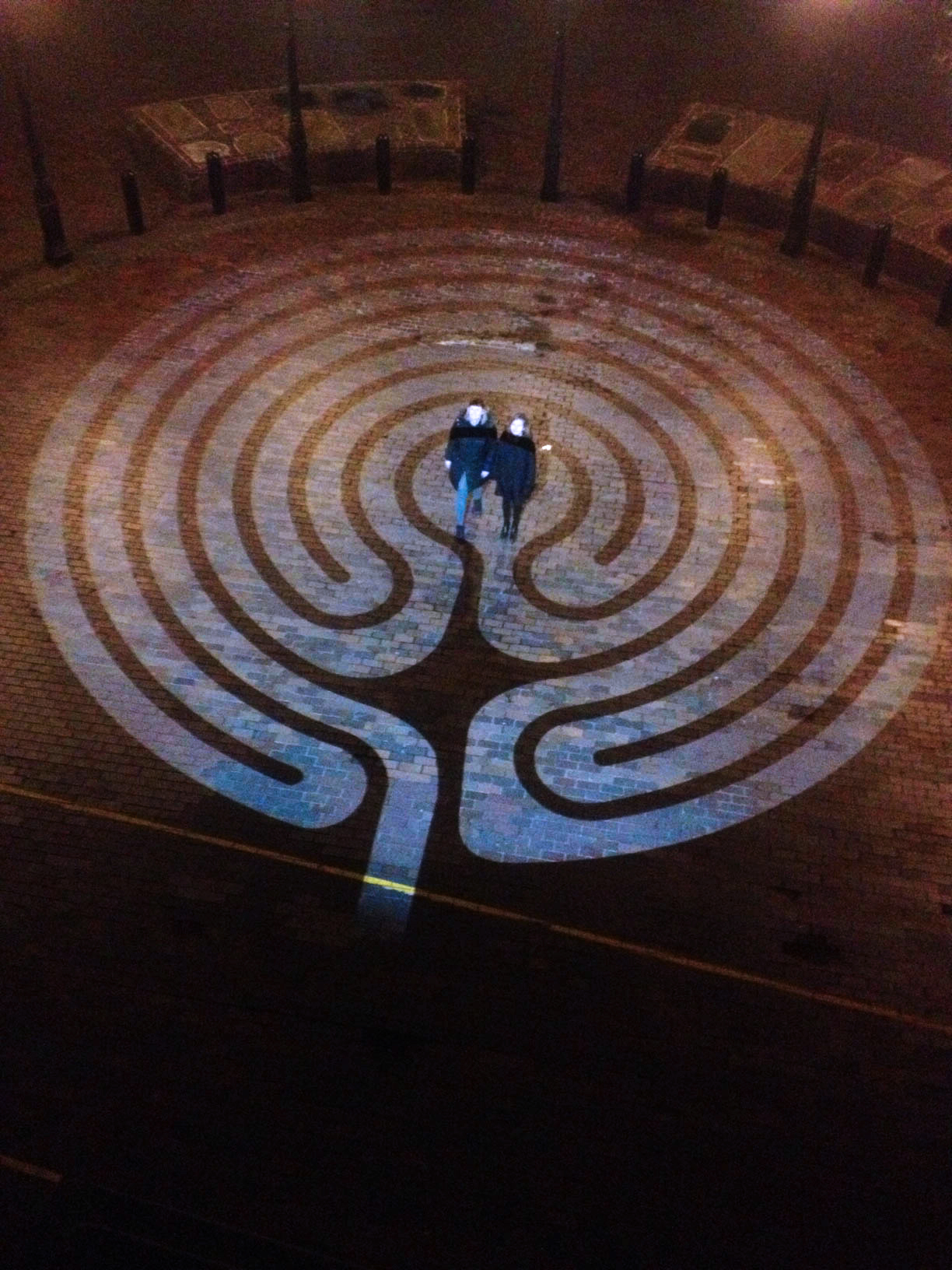 GoboPro LED projector used to make a labyrinth at night on the pavement.